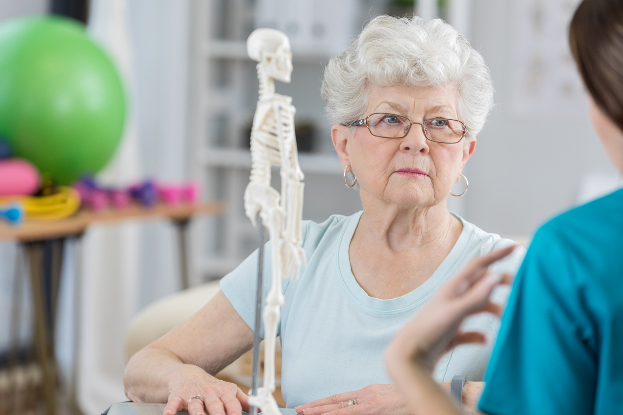 woman talking to doctor living with fibromyalgia