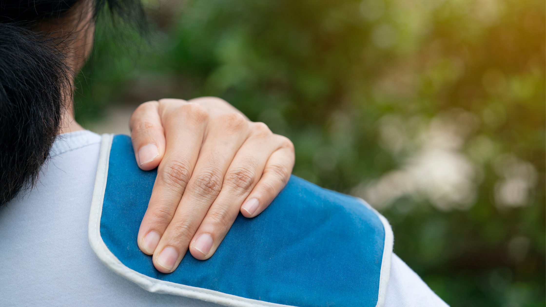 woman with ice pack on shoulder for natural muscle relief