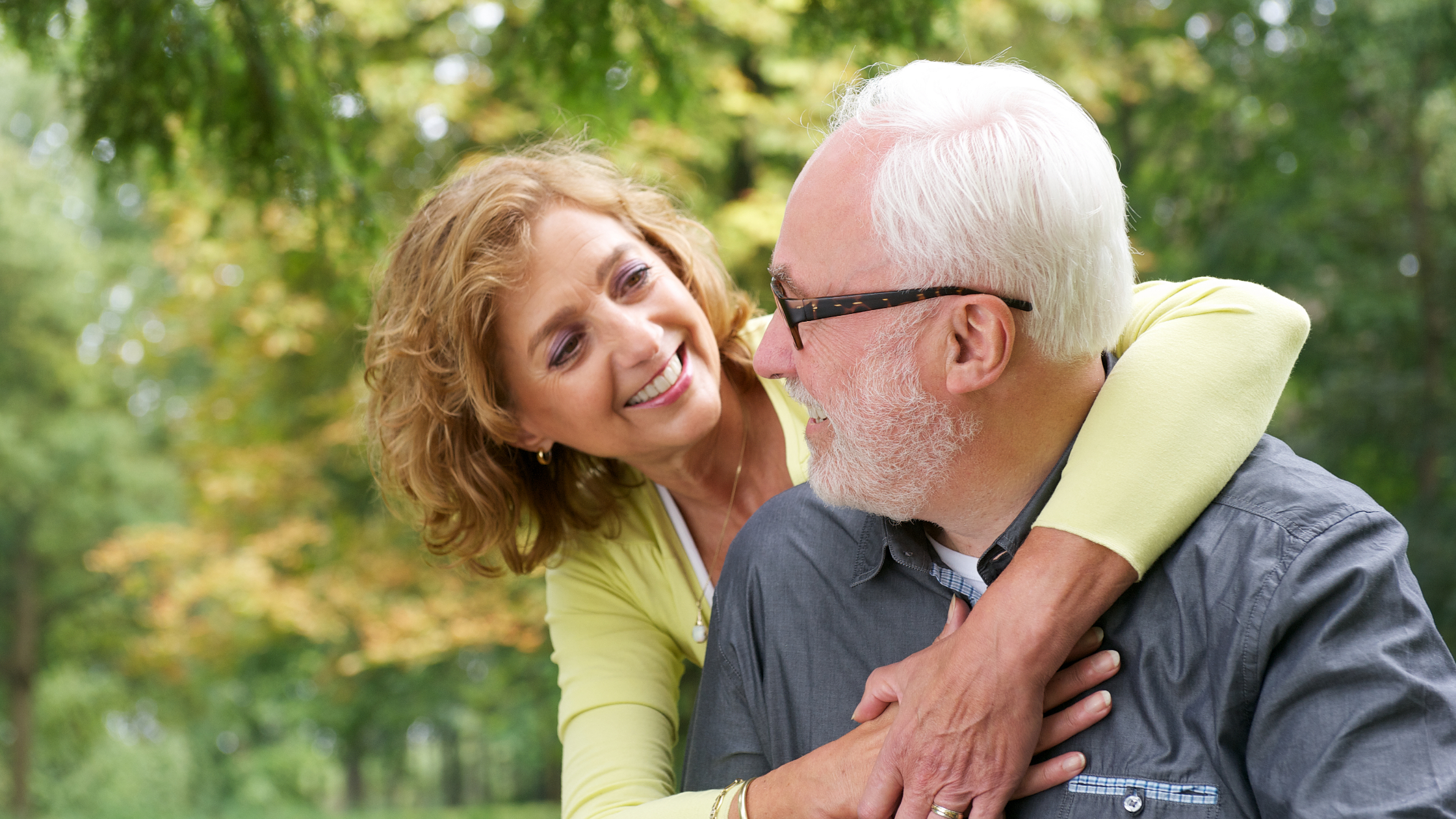 older couple smiling happy life with chronic pain