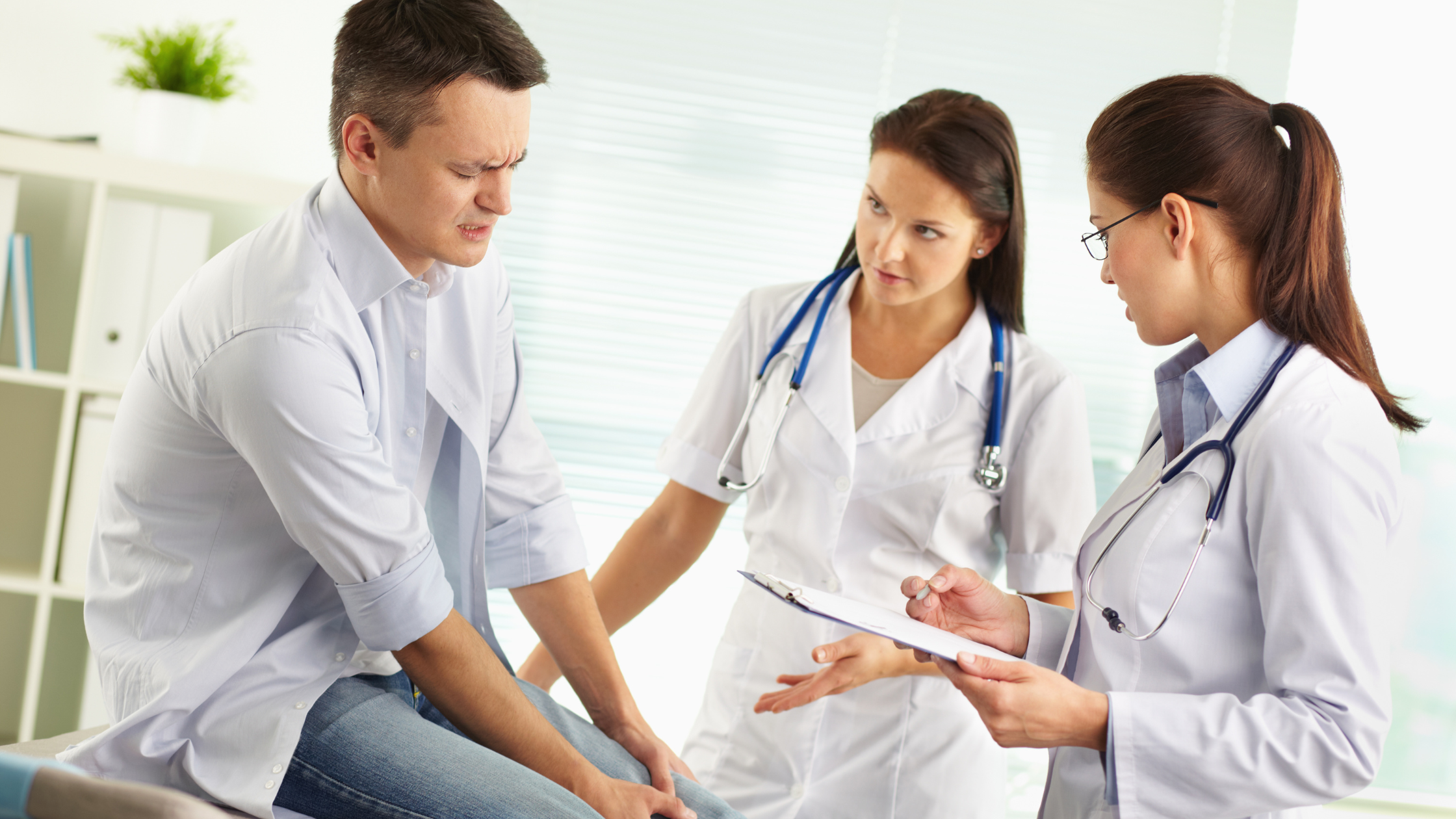 patient with pain specialist in office