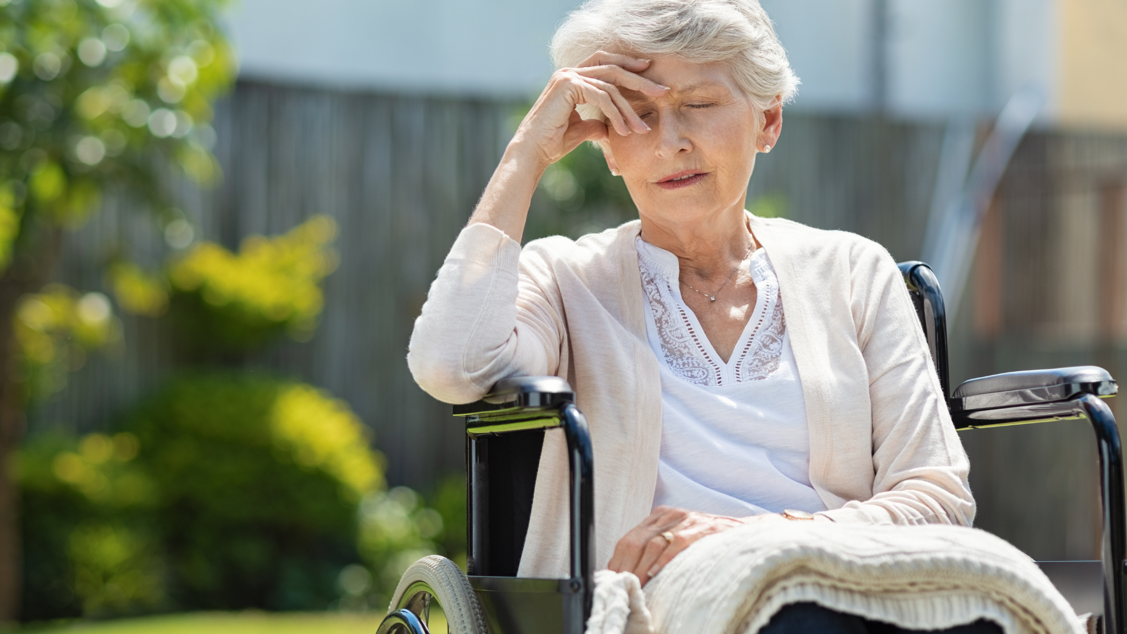 chronic pain in the elderly woman in wheelchair